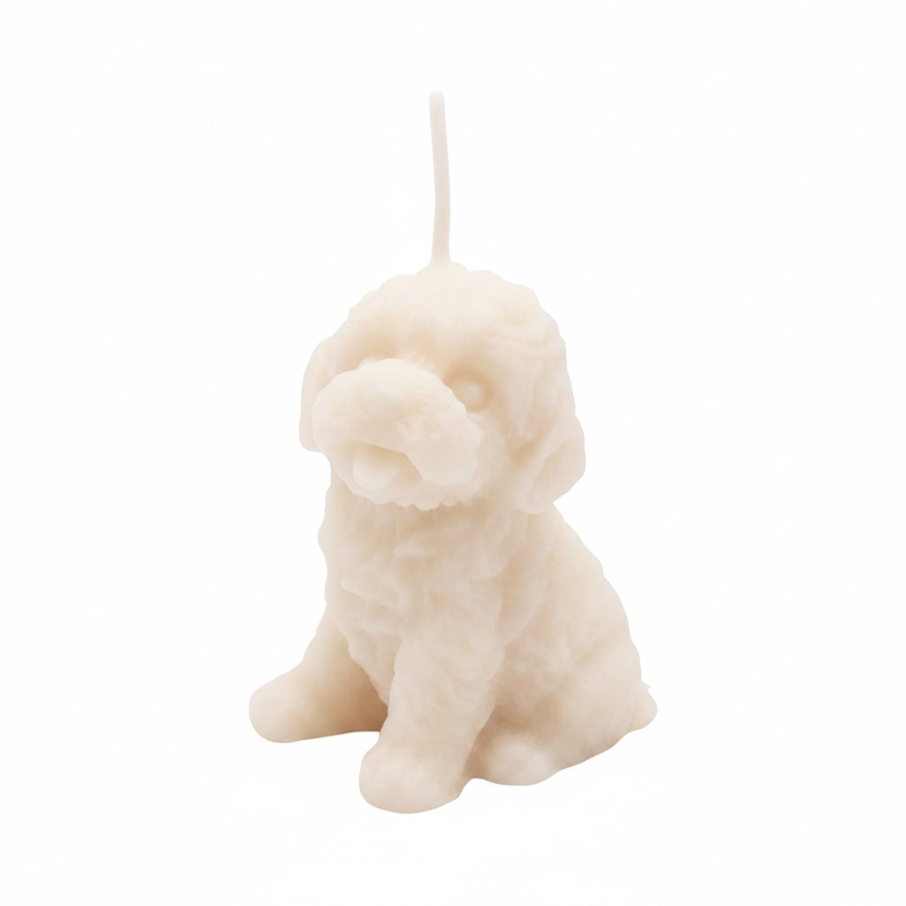 Pepper & White ivory puppy-shaped candle with detailed fur texture and freesia scent for home decor.