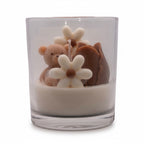 Pepper & White Bear Hugs Freesia scented candle in a glass jar with decorative teddy bear and flower wax embeds.