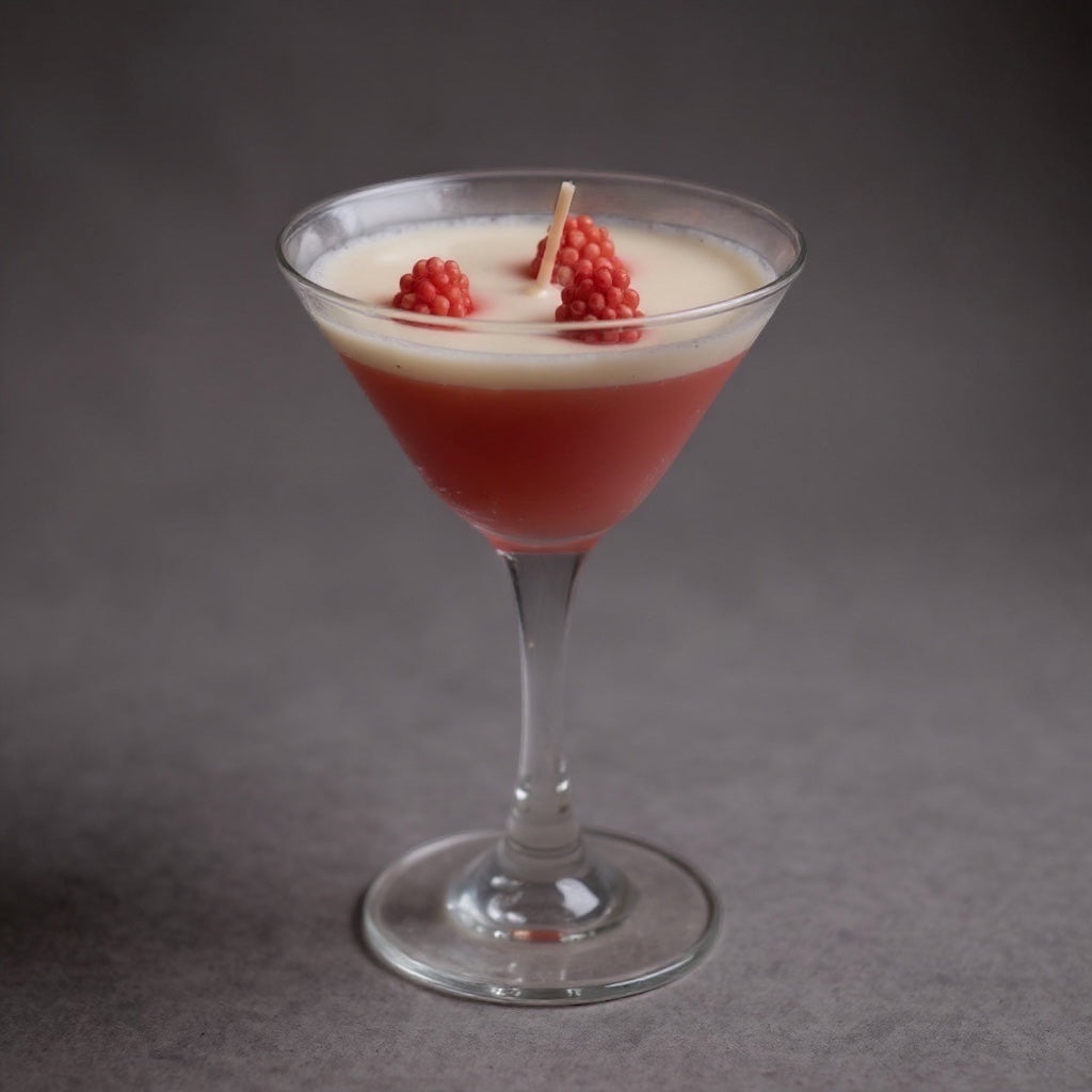 Pepper & White Scarlet Sip cranberry scented candle in a martini glass with wax raspberry decorations