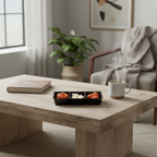 Pepper & White decorative wax candle set in assorted shapes and colors displayed on a wooden coffee table