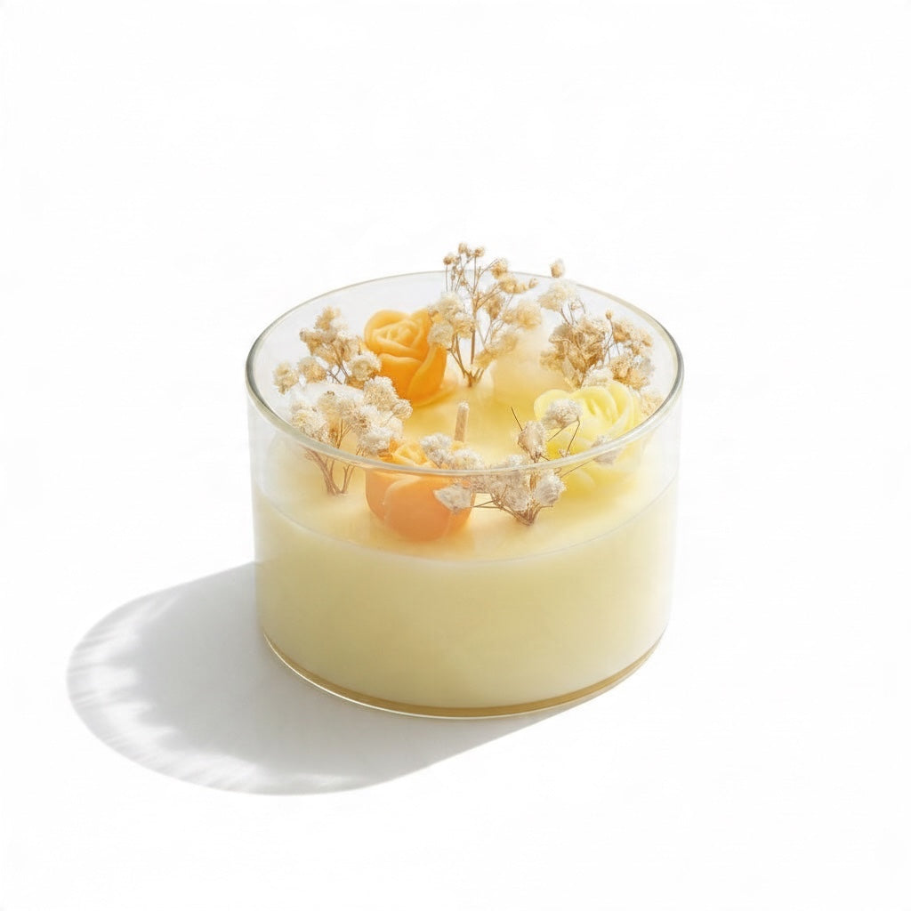 Pepper & White decorative glass jar candle with yellow wax roses and dried baby's breath botanical accents