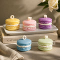 Pepper & White set of five pastel macaron-shaped wax candles in yellow, pink, purple, blue, and green on a white tray.