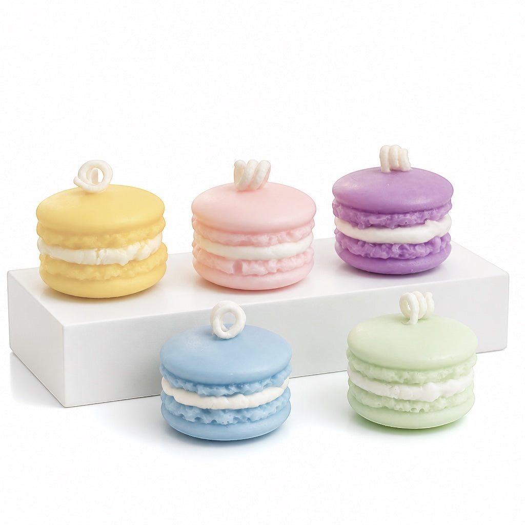 Pepper & White set of five colorful macaron-shaped wax candles in yellow, pink, purple, blue, and light green.