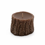 Pepper & White Wildwood Agarwood Rose scented candle shaped like a brown tree stump on a white background.